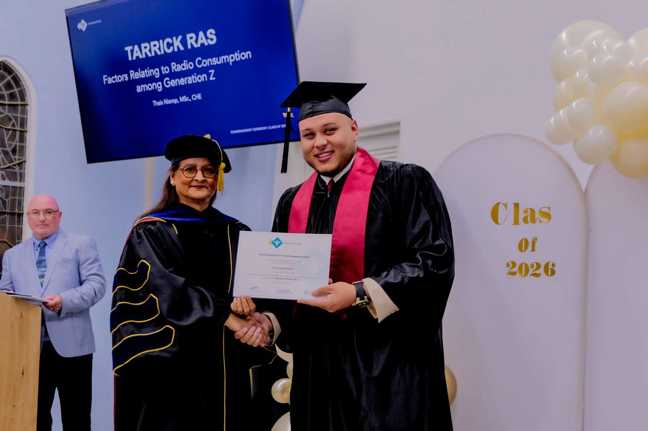 Proud of His Achievement: Tarrick Ras Earns Hospitality & Tourism Degree